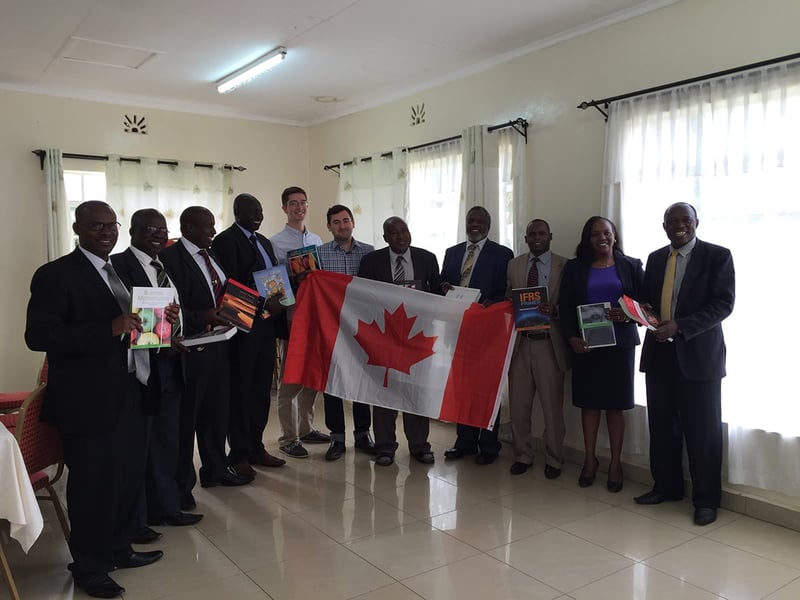 Textbooks for Change group photo with Canadian flag