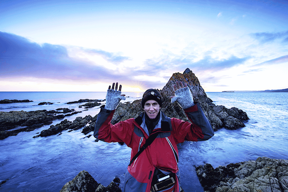 Tony R. showing off his Dachstein Woolwear Glomitts while exploring Rocky Cape National Park