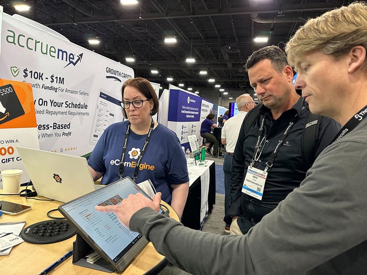 eComEngine employees talking with an Amazon seller